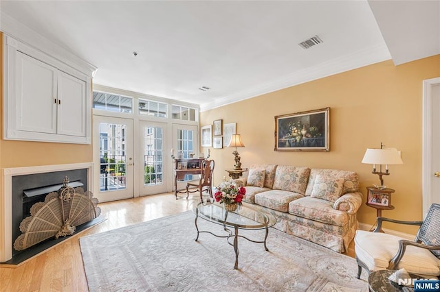 7108 Ravenscroft Rd Unit 555, Clifton, NJ 07013 - living area with light wood-style flooring, a fireplace, and ornamental molding