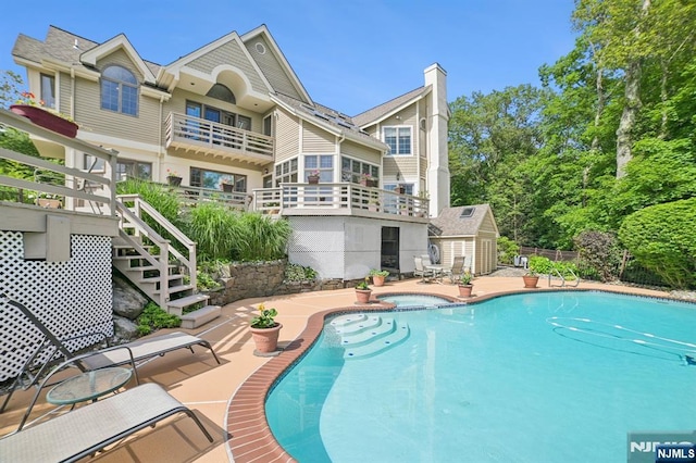 6 Summit, Kinnelon Borough, NJ 07405 - view of swimming pool featuring a patio area and a pool with connected hot tub