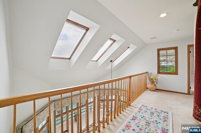 6 Summit, Kinnelon Borough, NJ 07405 - hallway featuring a skylight, carpet floors, lofted ceiling, and recessed lighting