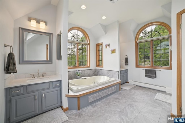 6 Summit, Kinnelon Borough, NJ 07405 - bathroom with a baseboard heating unit, lofted ceiling, plenty of natural light, two vanities, and a garden tub