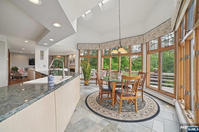 6 Summit, Kinnelon Borough, NJ 07405 - dining room featuring plenty of natural light, a high ceiling, recessed lighting, stone tile floors, and a chandelier
