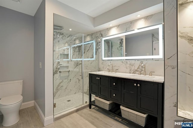 1 Columbus Pl, Cliffside Park, NJ 07010 - full bathroom with a marble finish shower, double vanity, and recessed lighting