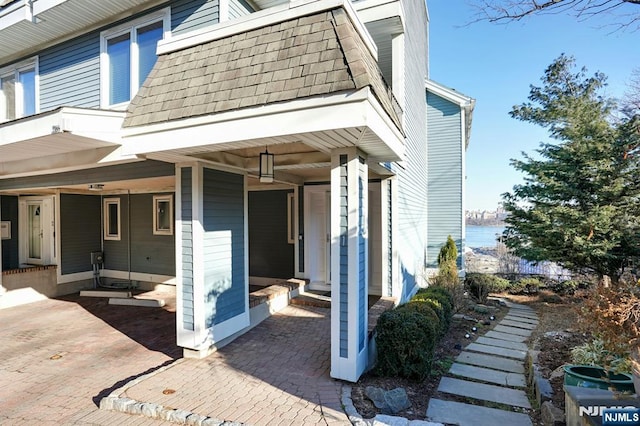 1 Columbus Pl, Cliffside Park, NJ 07010 - view of property exterior featuring a water view and roof with shingles