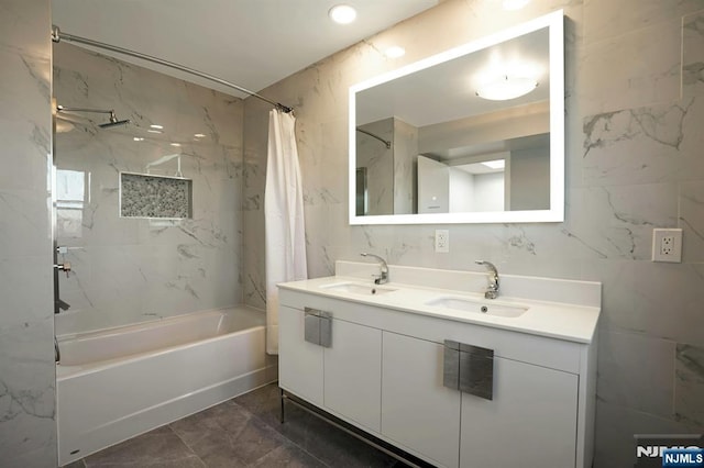 1 Columbus Pl, Cliffside Park, NJ 07010 - full bathroom featuring shower / bath combo with shower curtain, double vanity, marble finish flooring, and tile walls
