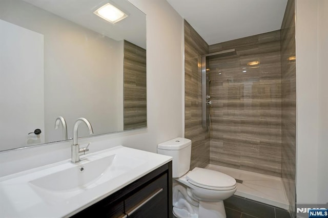 1 Columbus Pl, Cliffside Park, NJ 07010 - bathroom featuring vanity, a tile shower, and tile patterned floors