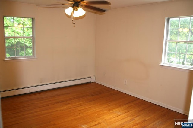 41 N Franklin Tpke Unit O, Ramsey, NJ 07446 - unfurnished room with a baseboard heating unit, light wood-style flooring, and a ceiling fan