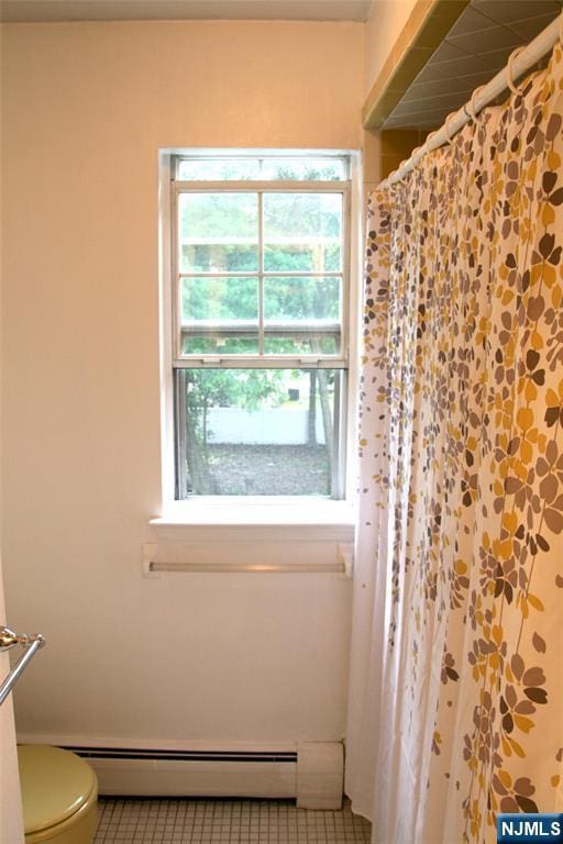 41 N Franklin Tpke Unit O, Ramsey, NJ 07446 - full bathroom with baseboard heating, tile patterned floors, and curtained shower