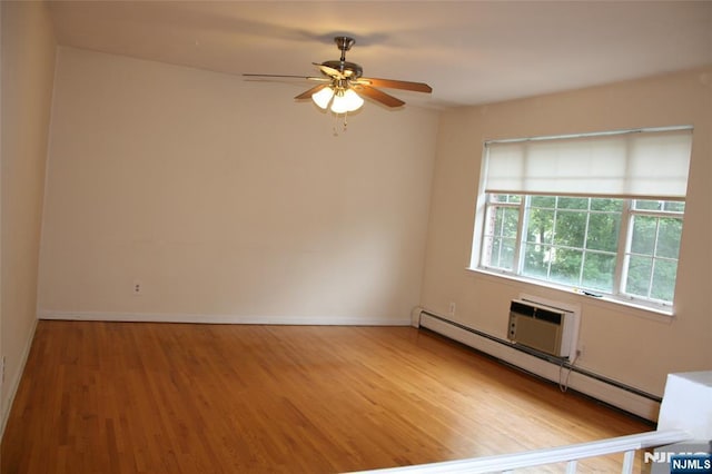 41 N Franklin Tpke Unit O, Ramsey, NJ 07446 - empty room featuring baseboard heating, wood finished floors, and a ceiling fan