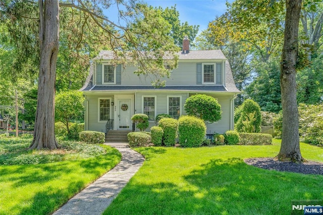 486 Summit Ave, Oradell, NJ 07649 - view of front facade with a chimney and a front lawn