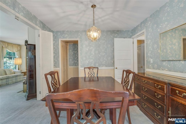 486 Summit Ave, Oradell, NJ 07649 - carpeted dining room with wallpapered walls, wainscoting, and a chandelier