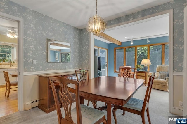 486 Summit Ave, Oradell, NJ 07649 - dining area with wallpapered walls, a baseboard heating unit, a ceiling fan, light colored carpet, and a chandelier