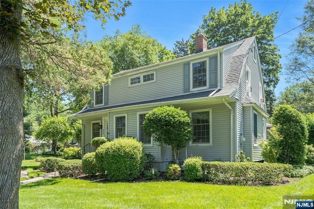 486 Summit Ave, Oradell, NJ 07649 - view of front of house with a chimney and a front lawn