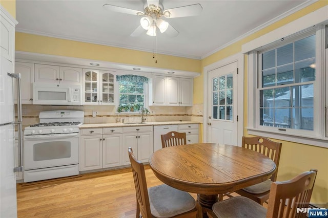 486 Summit Ave, Oradell, NJ 07649 - kitchen featuring white appliances, light countertops, decorative backsplash, white cabinets, and crown molding