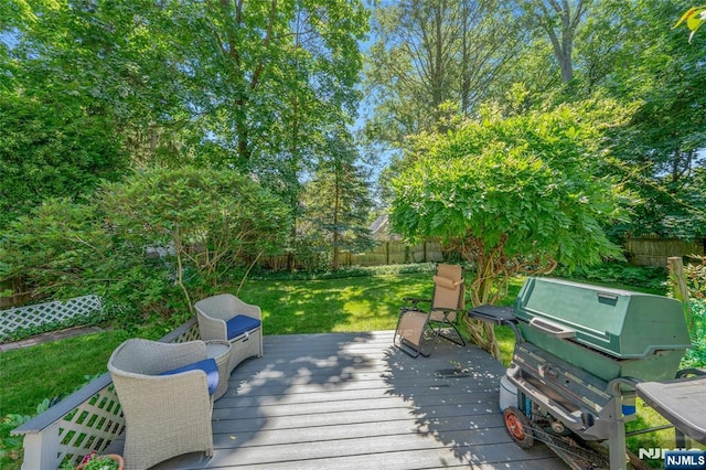 486 Summit Ave, Oradell, NJ 07649 - wooden deck with area for grilling and a fenced backyard