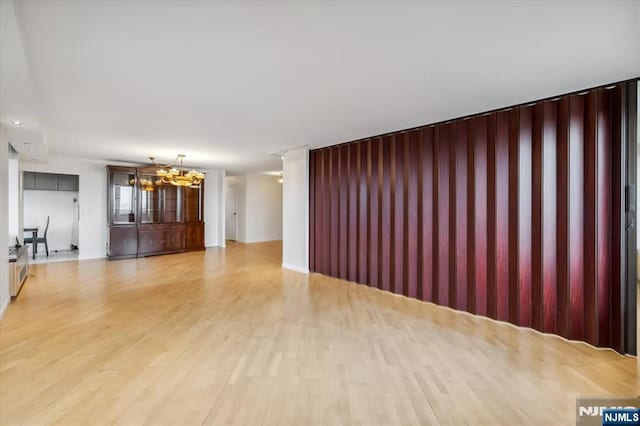 300 Winston Unit 1822, Cliffside Park, NJ 07010 - unfurnished living room featuring a chandelier and light wood-type flooring
