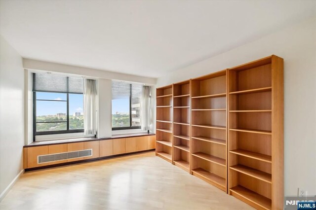 300 Winston Unit 1822, Cliffside Park, NJ 07010 - unfurnished room featuring light wood-type flooring and baseboards