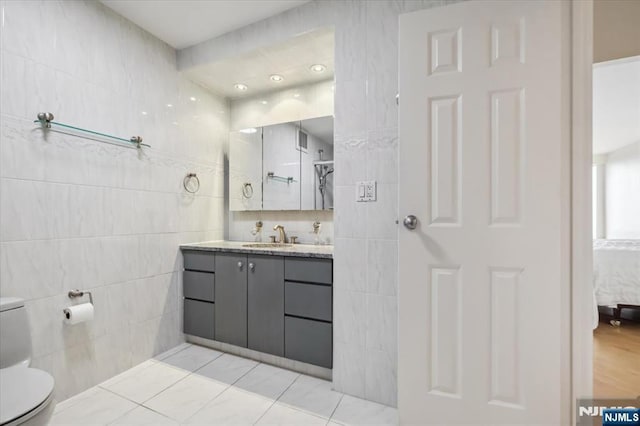 300 Winston Unit 1822, Cliffside Park, NJ 07010 - bathroom with tile walls, vanity, and connected bathroom