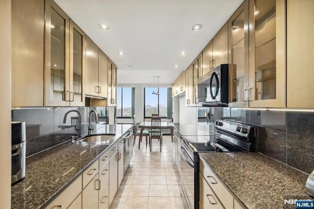 300 Winston Unit 1822, Cliffside Park, NJ 07010 - kitchen with stainless steel appliances, tasteful backsplash, recessed lighting, light tile patterned flooring, and glass insert cabinets