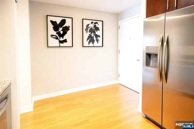 917 Hudson Park, Edgewater, NJ 07020 - kitchen with stainless steel fridge, light wood finished floors, and light countertops