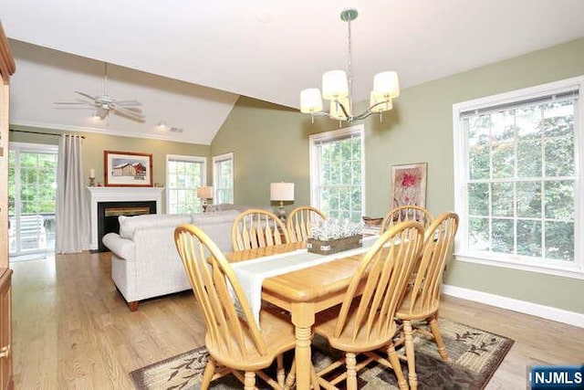 84 Pheasant Run Unit 84, Old Tappan, NJ 07675 - dining area with a chandelier, plenty of natural light, light wood-style floors, and vaulted ceiling