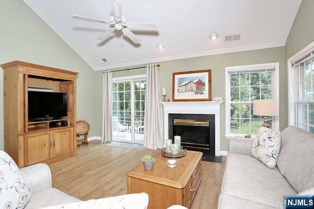 84 Pheasant Run Unit 84, Old Tappan, NJ 07675 - living area featuring lofted ceiling, light wood-type flooring, a fireplace with flush hearth, a ceiling fan, and ornamental molding