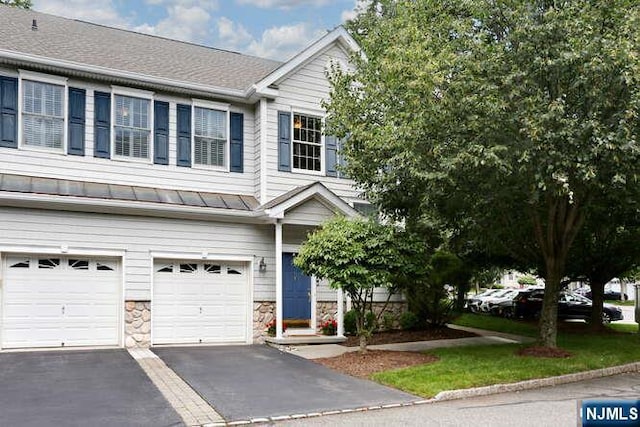 84 Pheasant Run Unit 84, Old Tappan, NJ 07675 - multi unit property featuring an attached garage, driveway, stone siding, and a standing seam roof
