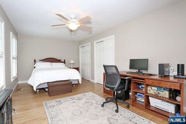 84 Pheasant Run Unit 84, Old Tappan, NJ 07675 - bedroom featuring multiple closets, an office area, wood finished floors, and a ceiling fan