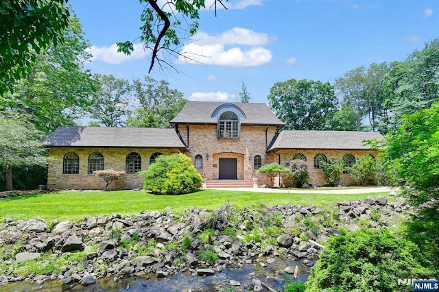 326 Ridge Rd, Cedar Grove, NJ 07009 - french provincial home featuring a front yard and stone siding
