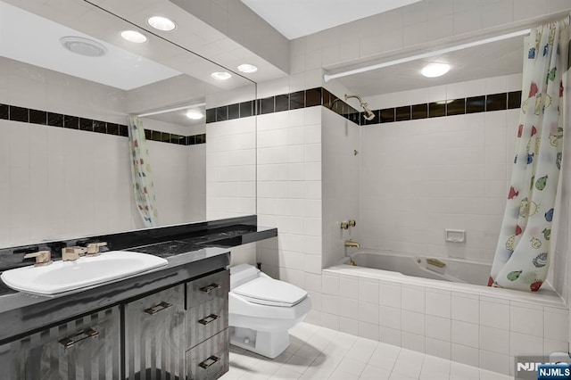 326 Ridge Rd, Cedar Grove, NJ 07009 - bathroom with tile walls, tiled shower / bath combo, tile patterned flooring, vanity, and recessed lighting