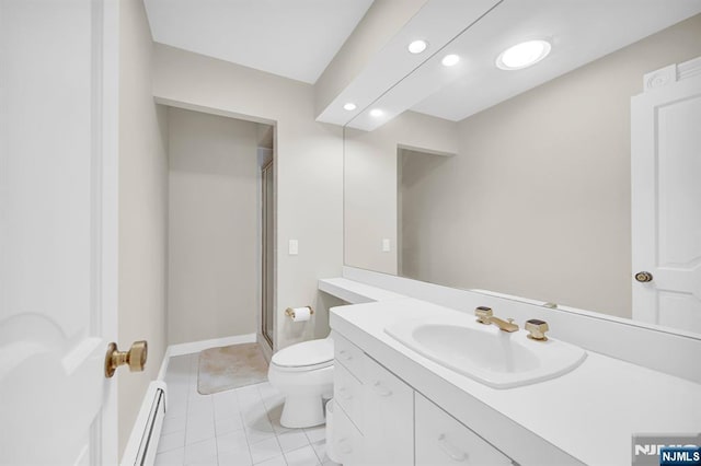 326 Ridge Rd, Cedar Grove, NJ 07009 - bathroom featuring a baseboard heating unit, vanity, a shower stall, tile patterned floors, and recessed lighting