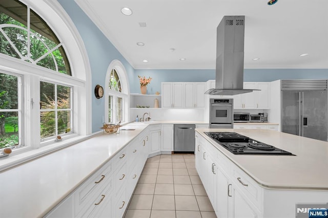 326 Ridge Rd, Cedar Grove, NJ 07009 - kitchen featuring stainless steel appliances, island exhaust hood, open shelves, light tile patterned floors, and light countertops