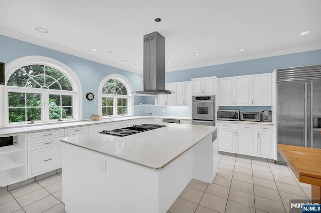 326 Ridge Rd, Cedar Grove, NJ 07009 - kitchen with appliances with stainless steel finishes, light tile patterned floors, island exhaust hood, light countertops, and white cabinets