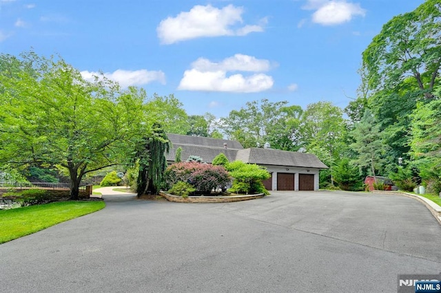 326 Ridge Rd, Cedar Grove, NJ 07009 - dutch colonial featuring an attached garage, asphalt driveway, and a shingled roof