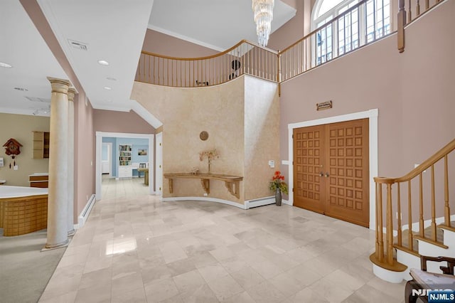 326 Ridge Rd, Cedar Grove, NJ 07009 - entryway with ornate columns, stairs, a high ceiling, ornamental molding, and a baseboard radiator