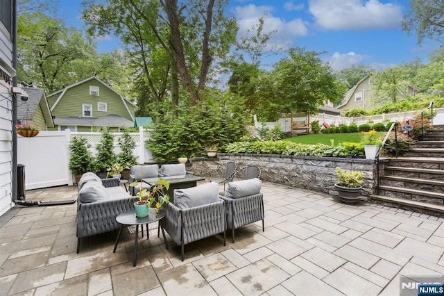 17 Lowell Ave, West Orange, NJ 07052 - fenced backyard featuring a patio, an outdoor hangout area, and stairs