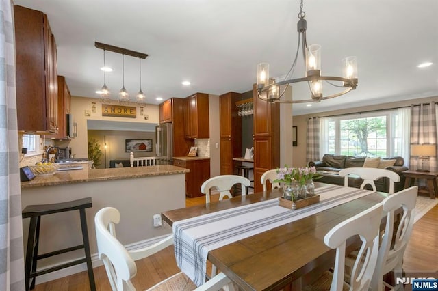 611 Maze Rd, River Vale, NJ 07675 - dining area with a chandelier, recessed lighting, and light wood finished floors