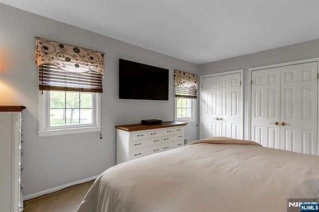 611 Maze Rd, River Vale, NJ 07675 - carpeted bedroom with multiple closets and baseboards