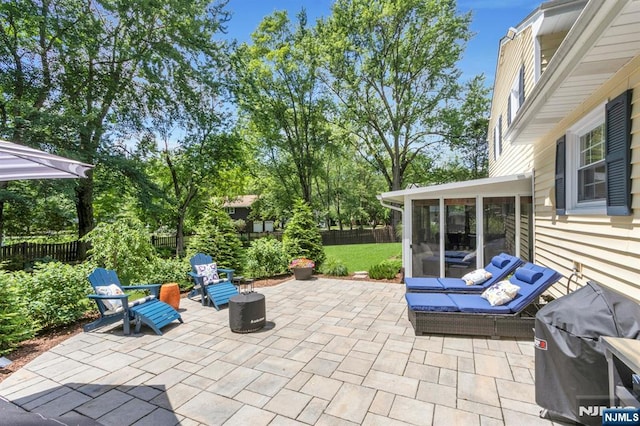 611 Maze Rd, River Vale, NJ 07675 - fenced backyard featuring a sunroom, area for grilling, and a patio area
