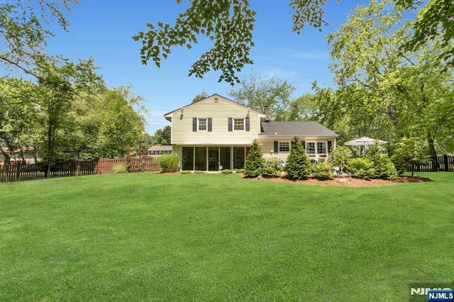 611 Maze Rd, River Vale, NJ 07675 - back of property with a sunroom and a chimney