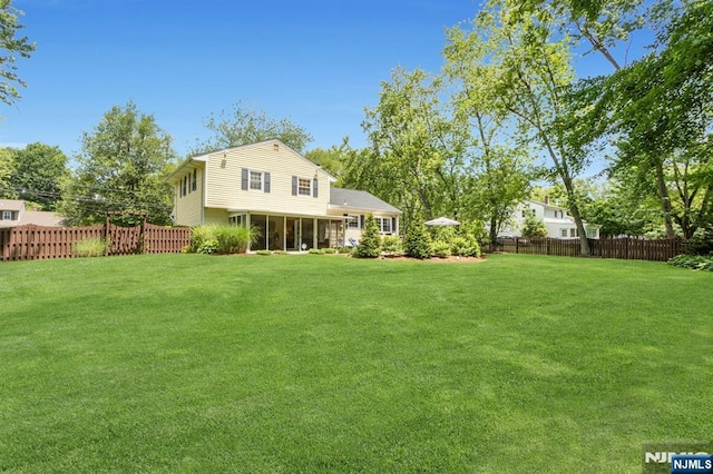 611 Maze Rd, River Vale, NJ 07675 - back of property featuring a fenced backyard and a sunroom
