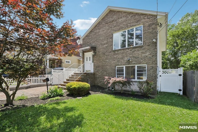 237 W Madison Ave, Dumont, NJ 07628 - view of front of property featuring brick siding and a gate