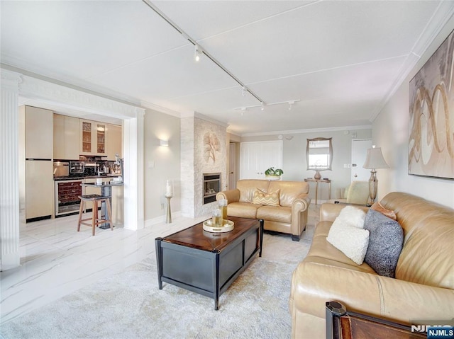 250 Gorge Rd Unit 23I, Cliffside Park, NJ 07010 - living room featuring rail lighting, beverage cooler, ornamental molding, and a fireplace