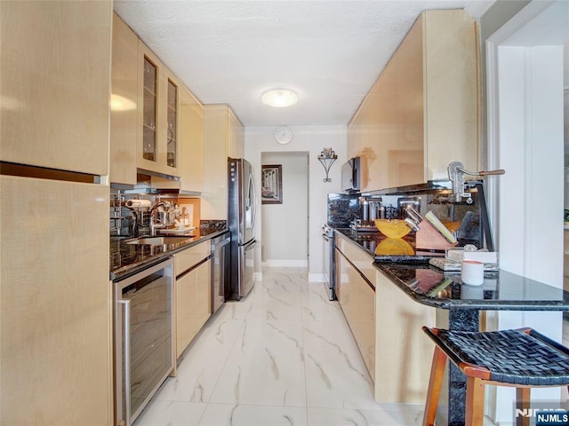 250 Gorge Rd Unit 23I, Cliffside Park, NJ 07010 - kitchen featuring wine cooler, stainless steel appliances, light marble finish flooring, glass insert cabinets, and light brown cabinets