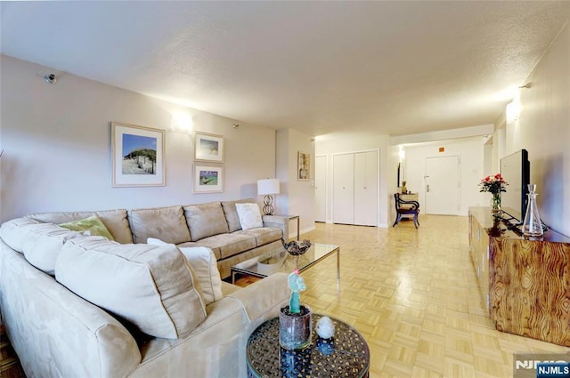 1265 15th St Unit 4C, Fort Lee, NJ 07024 - living area with a textured ceiling