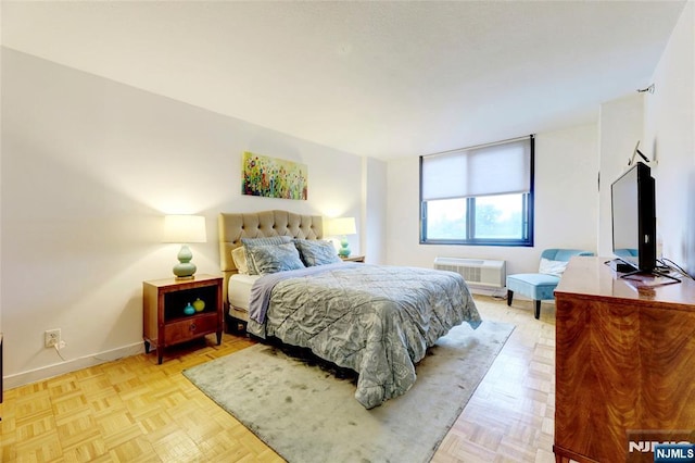 1265 15th St Unit 4C, Fort Lee, NJ 07024 - bedroom featuring an AC wall unit and baseboards