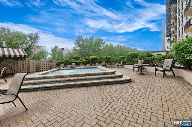 1265 15th St Unit 4C, Fort Lee, NJ 07024 - view of pool featuring a hot tub and a patio