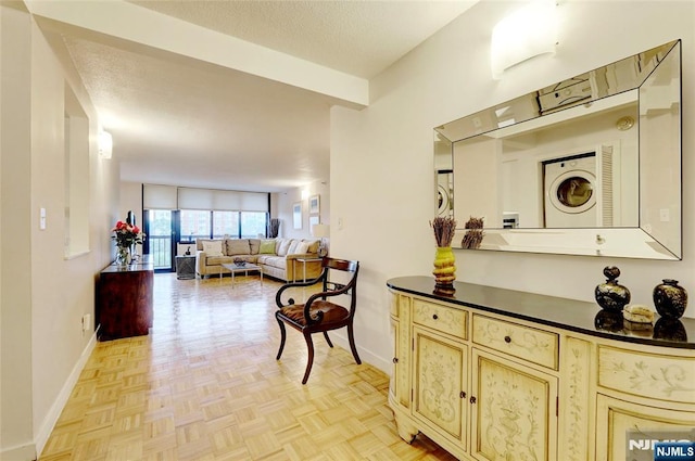1265 15th St Unit 4C, Fort Lee, NJ 07024 - hallway featuring baseboards and a textured ceiling