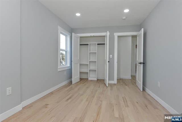 584 N Lake Shr, West Milford, NJ 07421 - unfurnished bedroom with light wood-style flooring, recessed lighting, and a closet