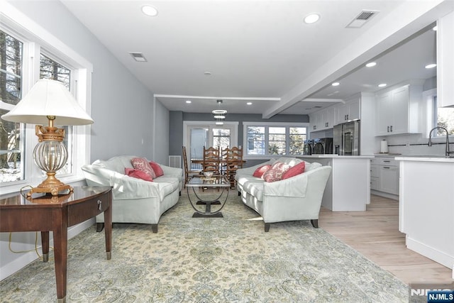 584 N Lake Shr, West Milford, NJ 07421 - living area with light wood-style floors, recessed lighting, and beam ceiling