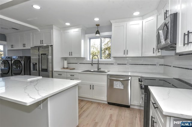 584 N Lake Shr, West Milford, NJ 07421 - kitchen featuring washing machine and dryer, stainless steel appliances, plenty of natural light, white cabinets, and recessed lighting